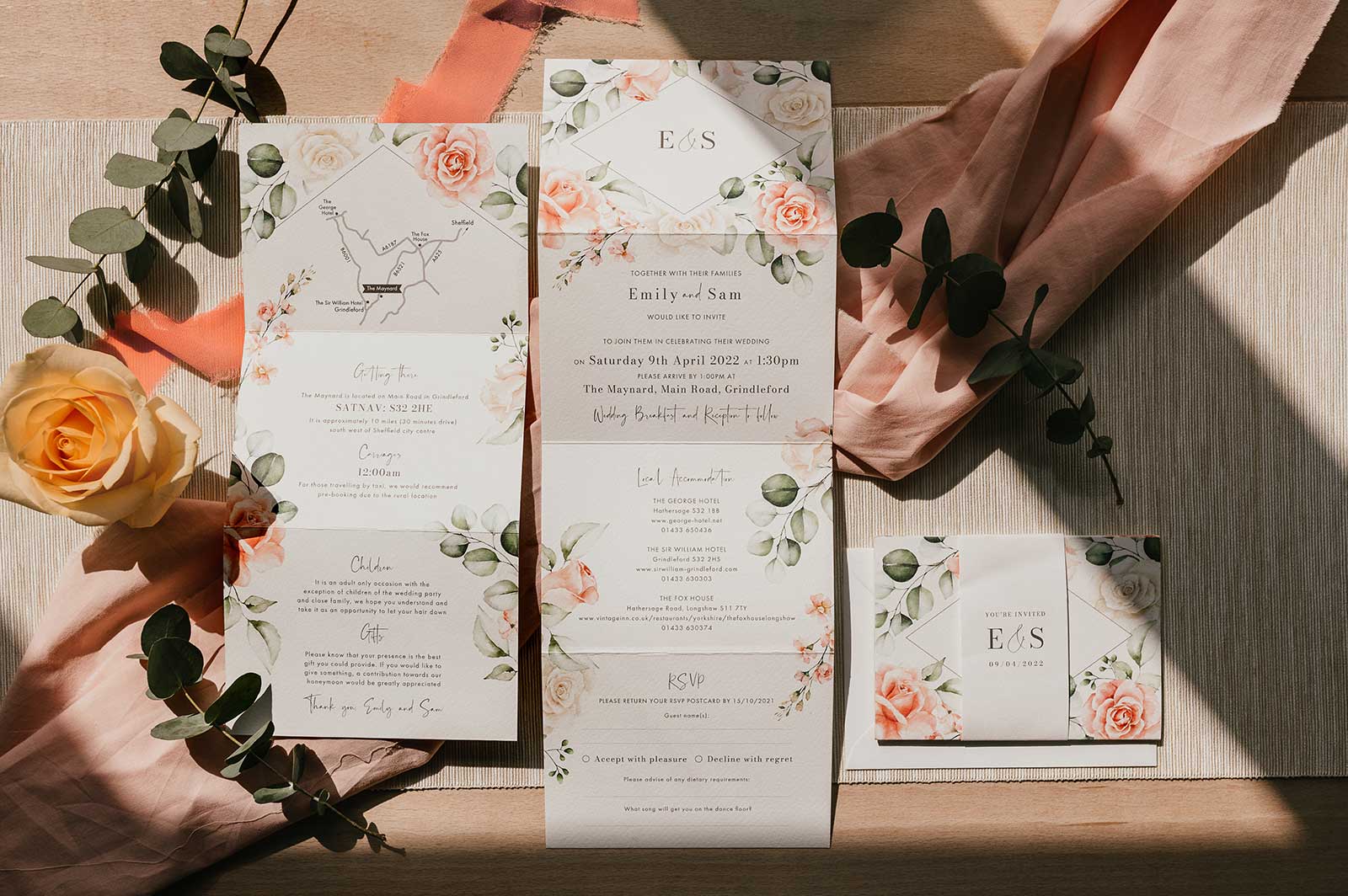 blush floral folded wedding invitation